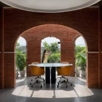 Logic Design + Build Reinvents an Office with Brick Arches and Mondrian-Inspired Interiors