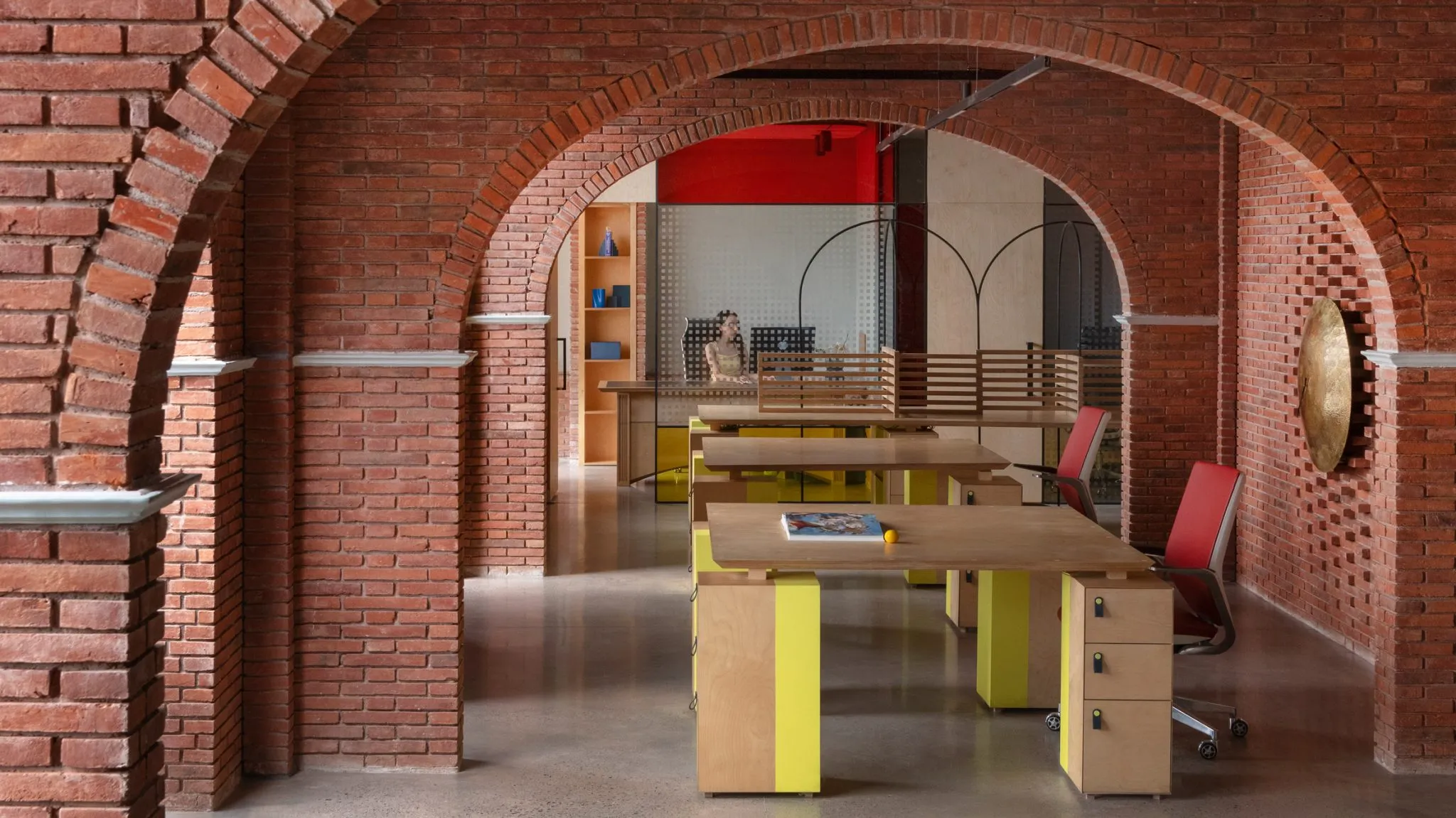 Logic Design + Build Reinvents an Office with Brick Arches and Mondrian-Inspired Interiors