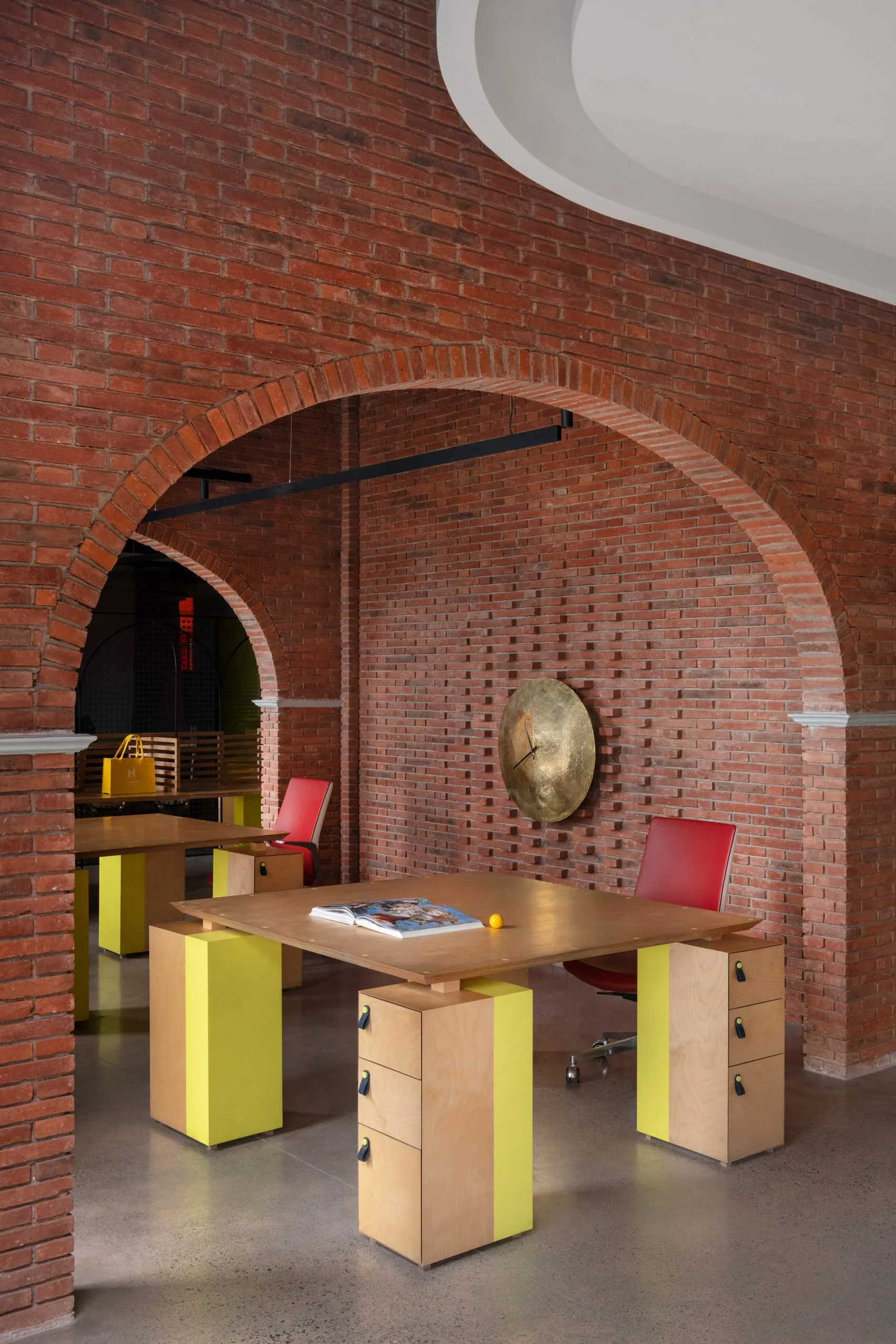 Logic Design + Build Reinvents an Office with Brick Arches and Mondrian-Inspired Interiors