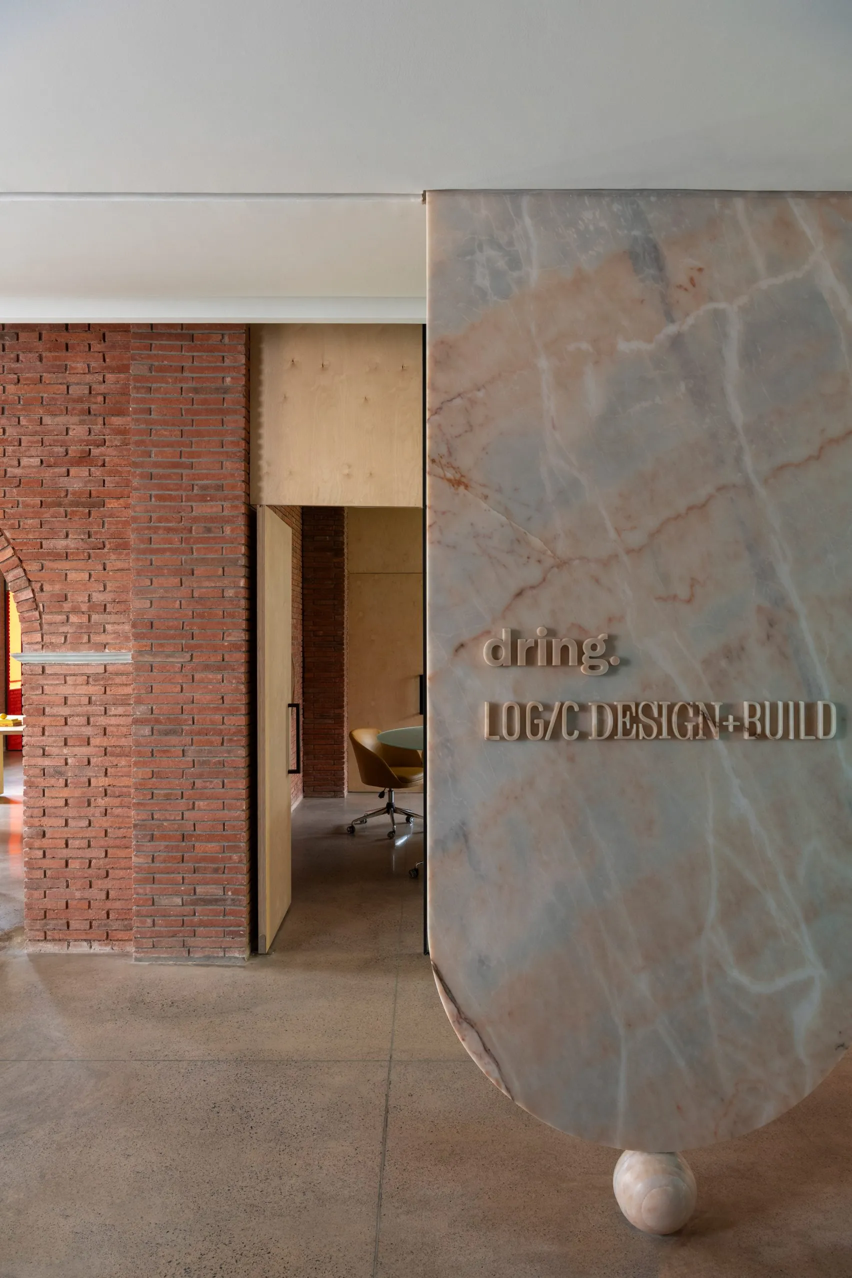 Logic Design + Build Reinvents an Office with Brick Arches and Mondrian-Inspired Interiors
