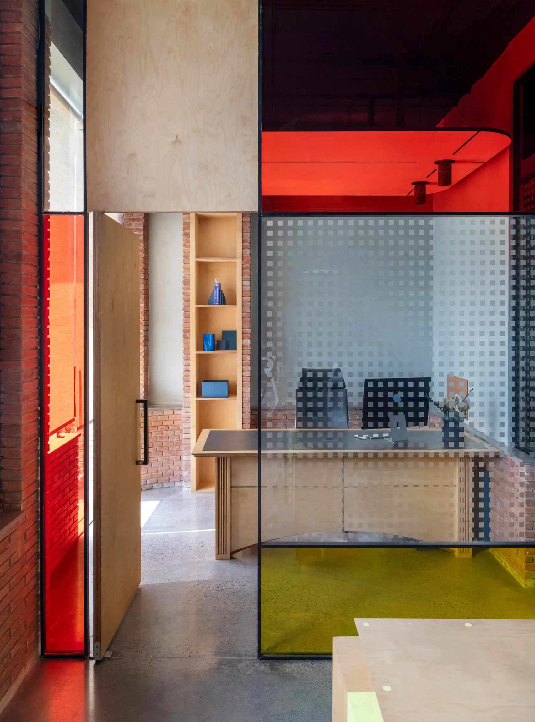 Logic Design + Build Reinvents an Office with Brick Arches and Mondrian-Inspired Interiors