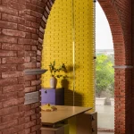 Logic Design + Build Reinvents an Office with Brick Arches and Mondrian-Inspired Interiors