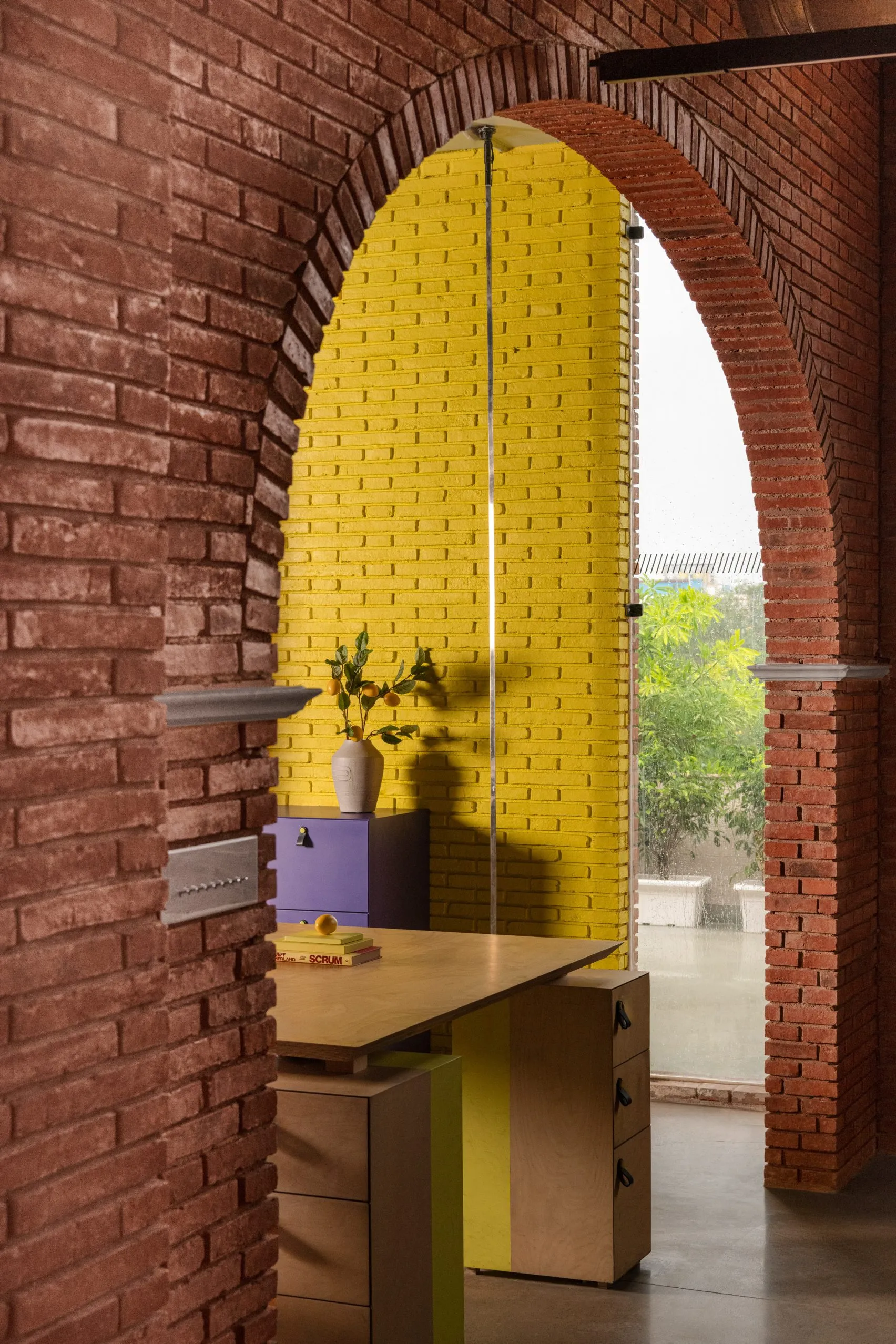 Logic Design + Build Reinvents an Office with Brick Arches and Mondrian-Inspired Interiors