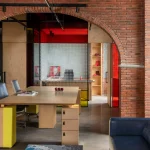 Logic Design + Build Reinvents an Office with Brick Arches and Mondrian-Inspired Interiors